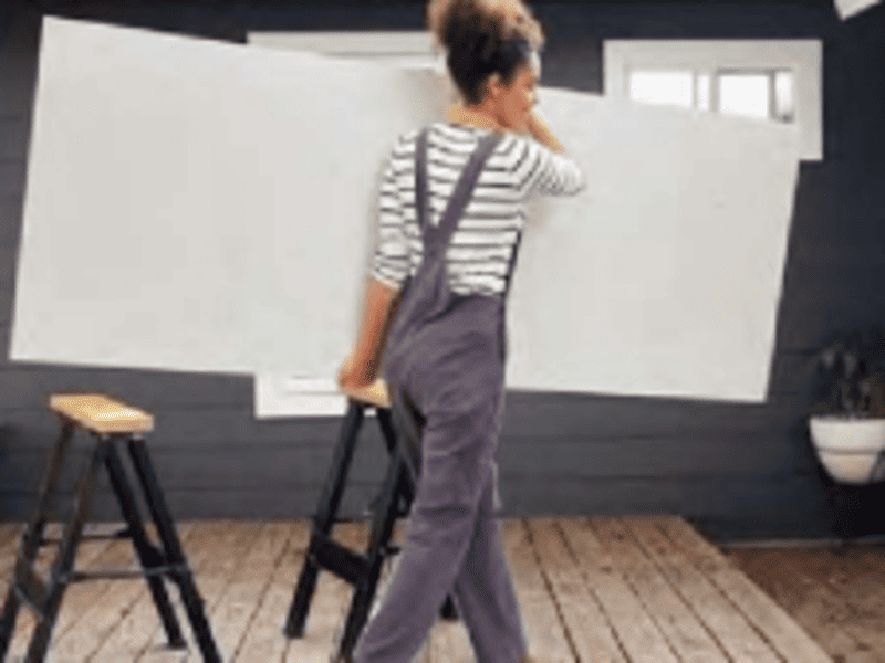 Lightweight SPC wall panel being lifted