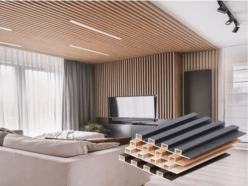 Modern living room with WPC slatted wall panels and a sample display of WPC structural layers in the foreground.